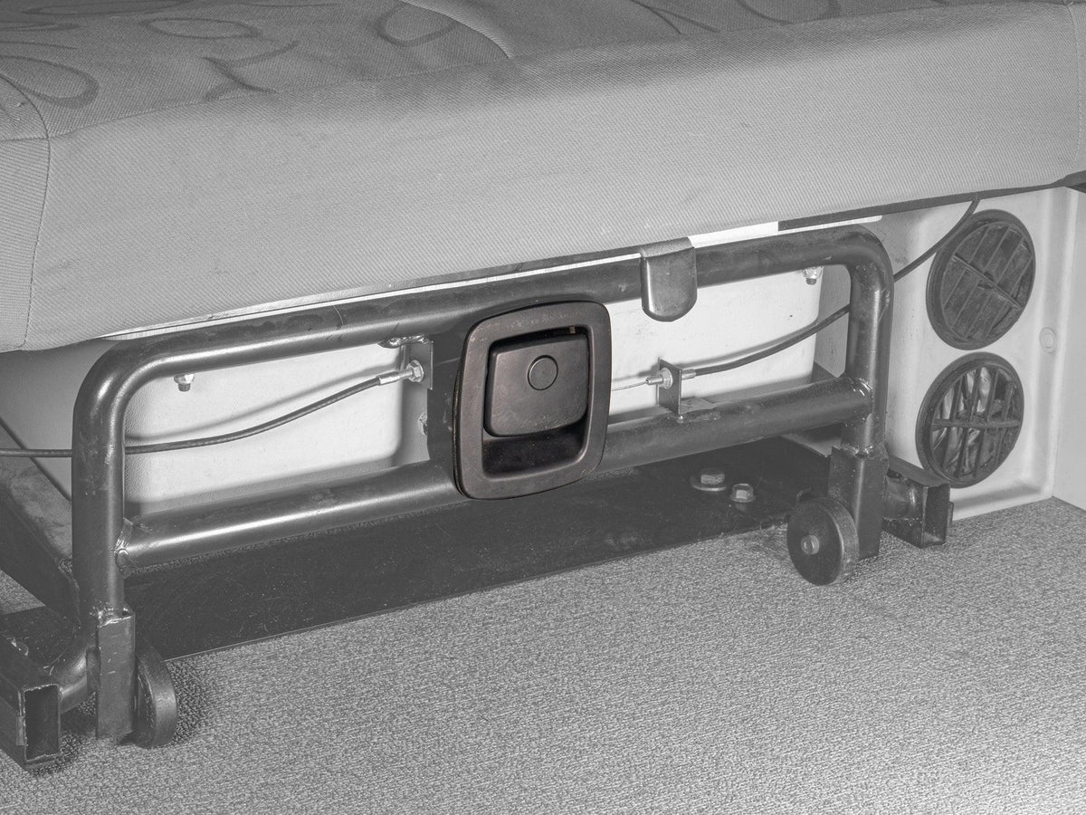 GoWesty rear bench seat latch installed in Eurovan Winnebago, showing the seat part attached inside the vehicle.