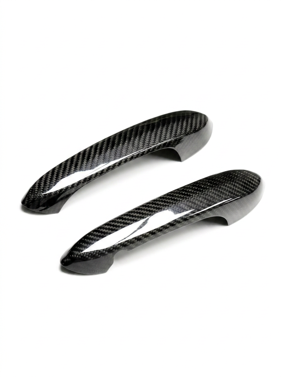 BMW 4 Series G82 M4 carbon fiber door handle cover by K2 Industries, showcasing sleek textured finish on vehicle door handle.
