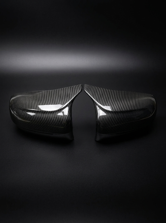 BMW 5 Series F90 M5 carbon fiber side mirror cover by K2 Industries, showing sleek, textured lightweight mirror accessory.