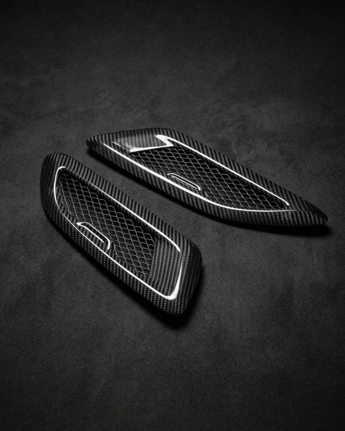BMW F80 M3, F82 M4, F87 M2, F90 M5, G30 carbon fiber hood vents by K2 Industries, showing sleek aerodynamic vents on the hood.