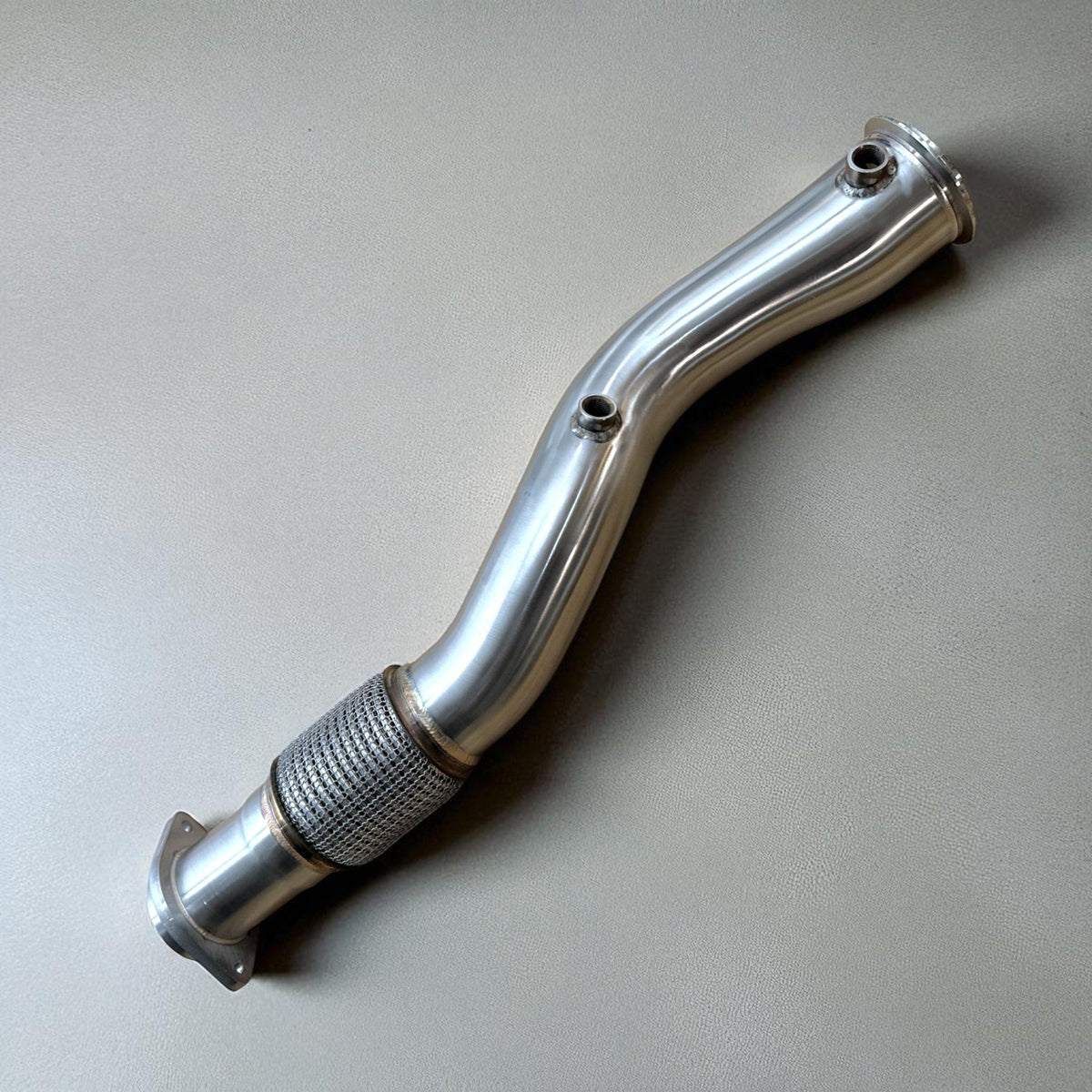 BMW S58 X3M and X4M catless race downpipe by Palenon Performance, 3.5 inch exhaust pipe with sleek metallic finish.