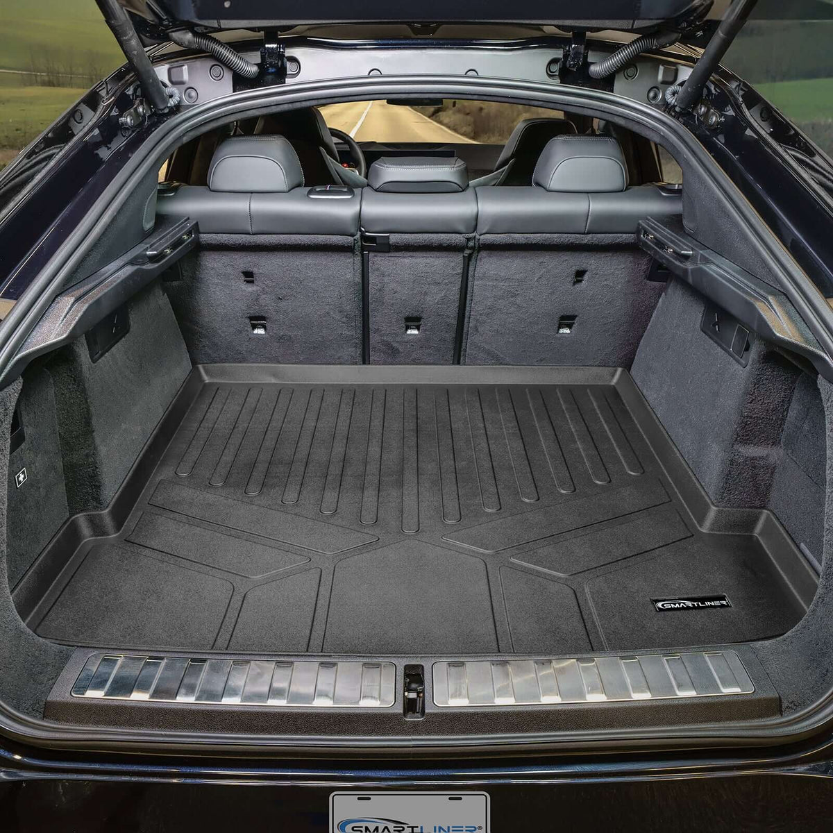 Smartliner USA cargo liner for BMW X6 40i (2020-2027) with spare tire, showing durable, custom-fit interior protection in a studio setting.