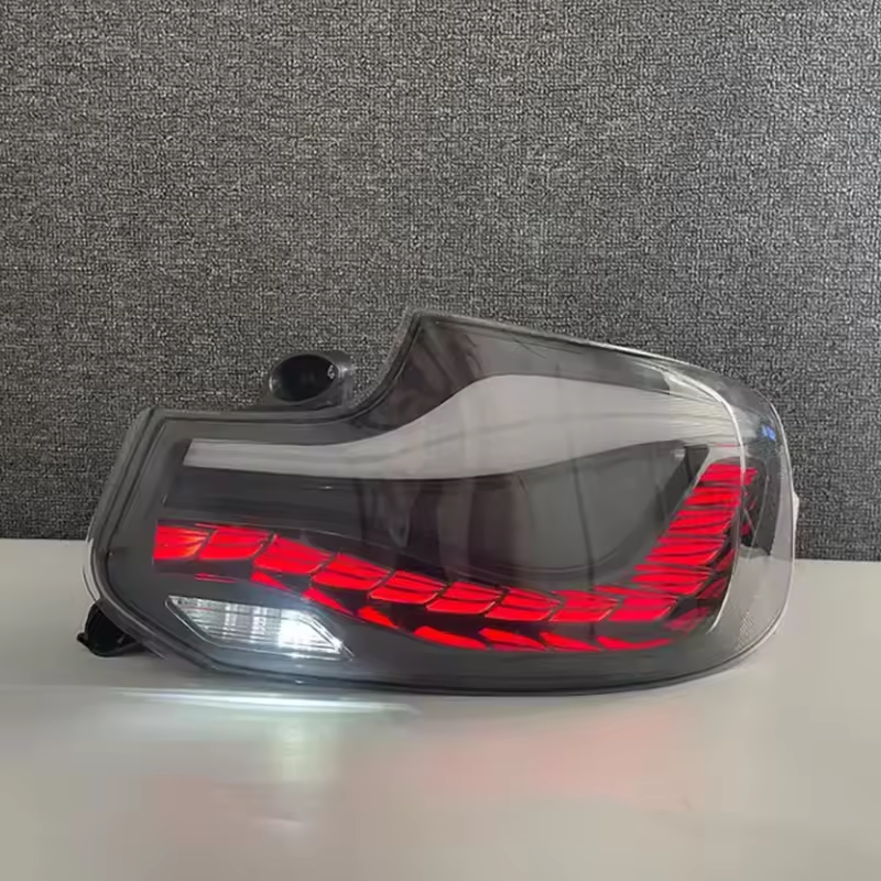Vekto GTS Dragon Scale LED taillights on a BMW 2 Series F22, rear view showing red and clear lens design for 2014-2021.