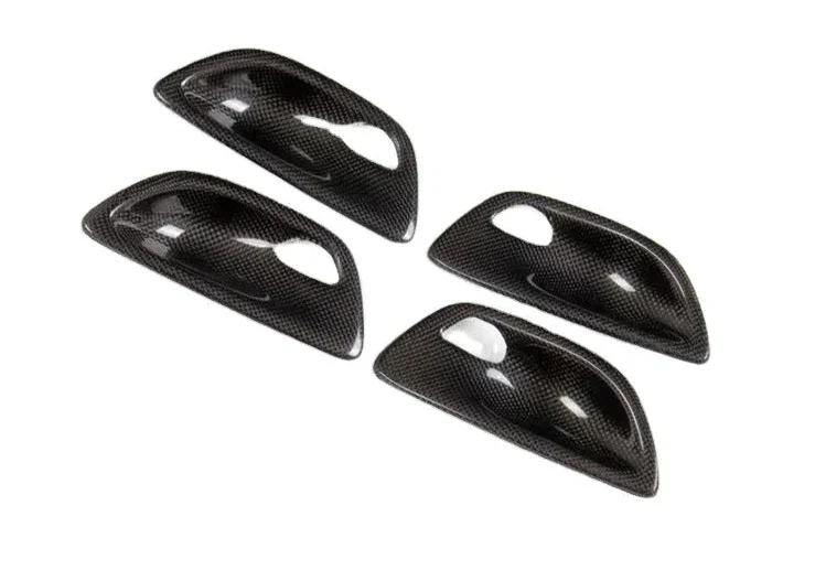 Carbon fiber interior door handle trim set for BMW F10 5 Series by K2 Industries, performance-style door handle covers.
