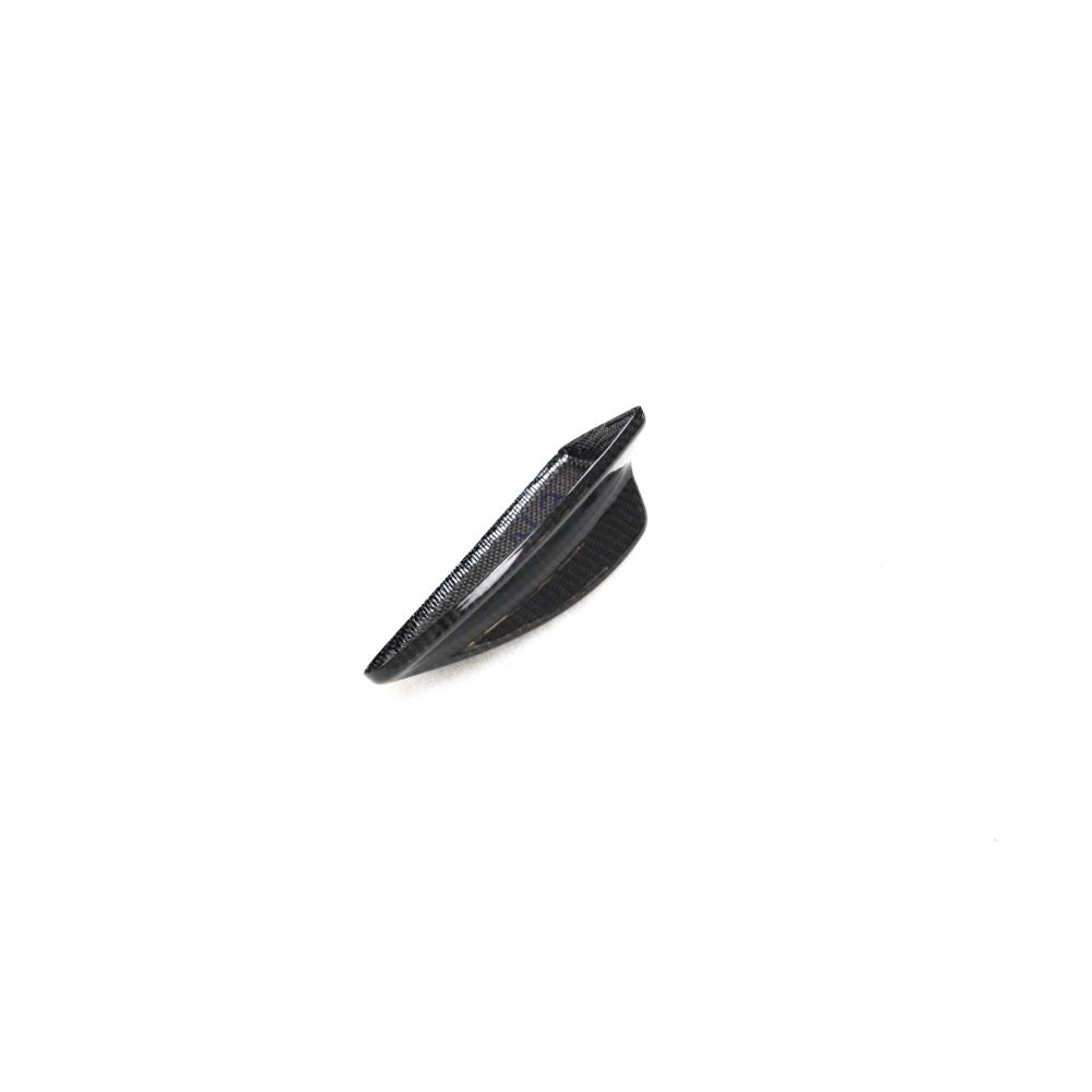 Black carbon fiber roof antenna cover for BMW E82, E87, E90, E92, E93 by Palenon Performance, shown on a vehicle roof.