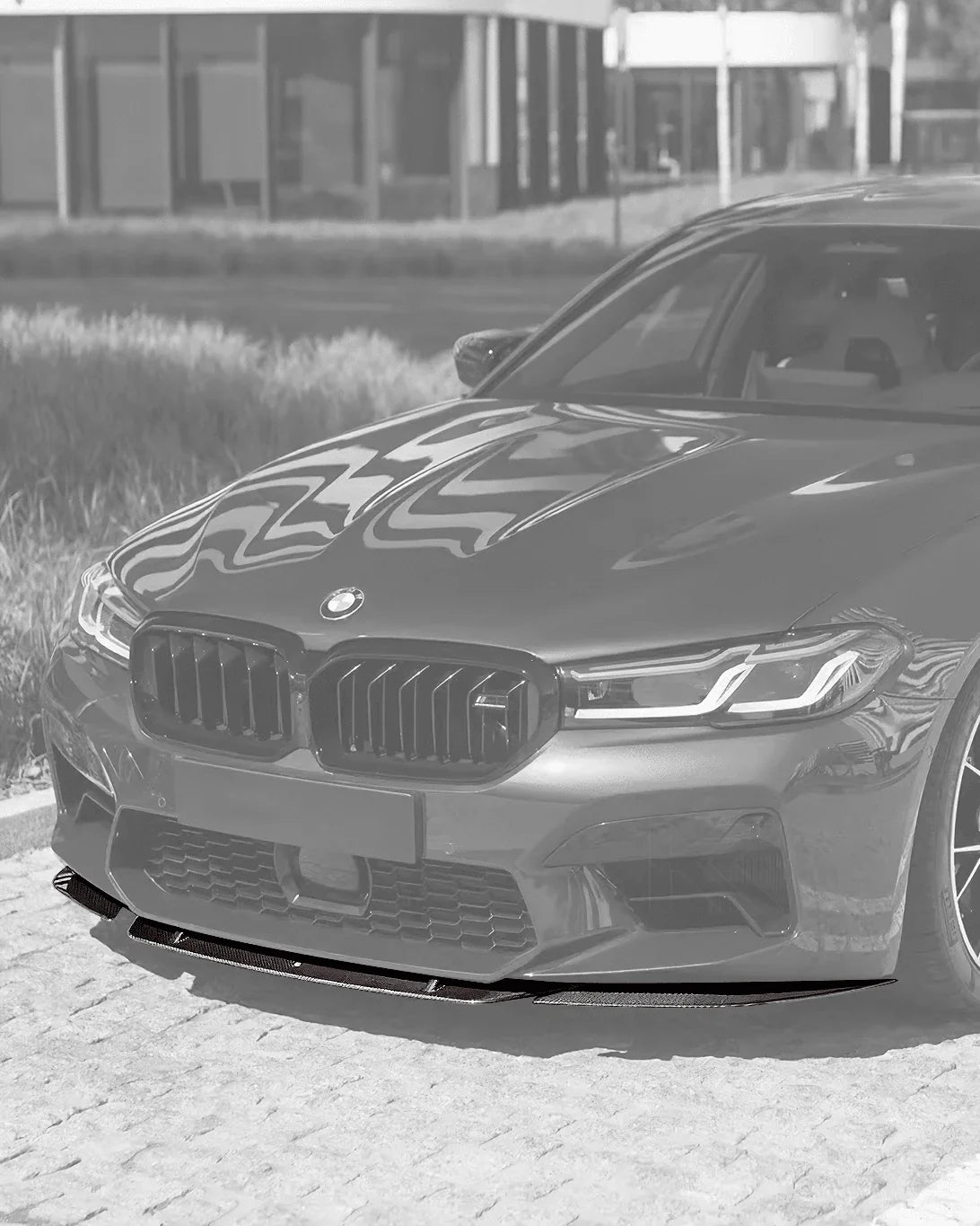 BMW 5 Series F90 M5 LCI ST Style carbon fiber front lip by K2 Industries, showcasing the sleek aerodynamic design on a 2020+ model.