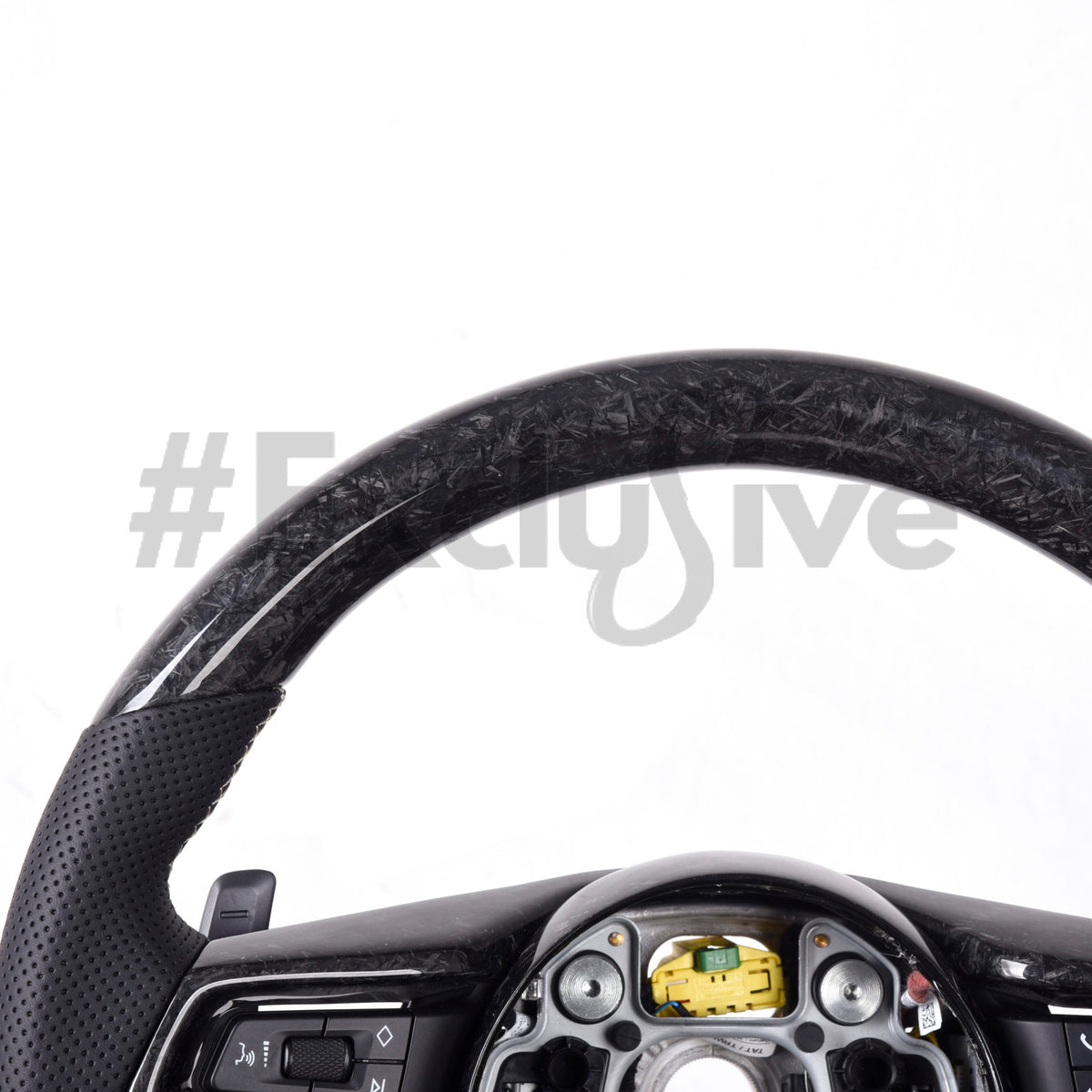 Custom carbon fiber steering wheel for Porsche 911 (992), Taycan, and Macan by Exclusive Steering, shown with detailed craftsmanship.