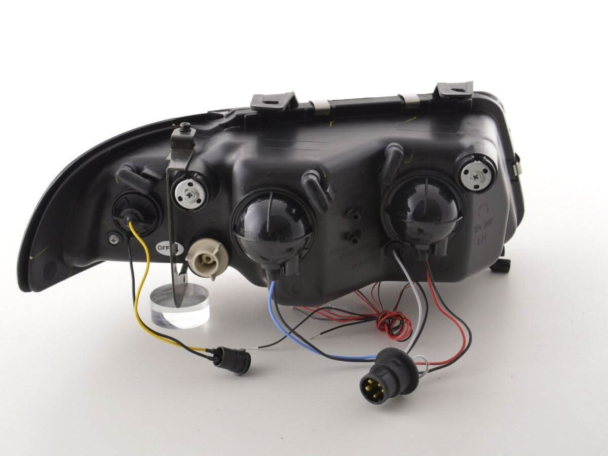 Audi A4 B5 8D black angel eye headlights set by K2 Industries, 1995-1999, showing sleek black headlight design with angel eye rings.