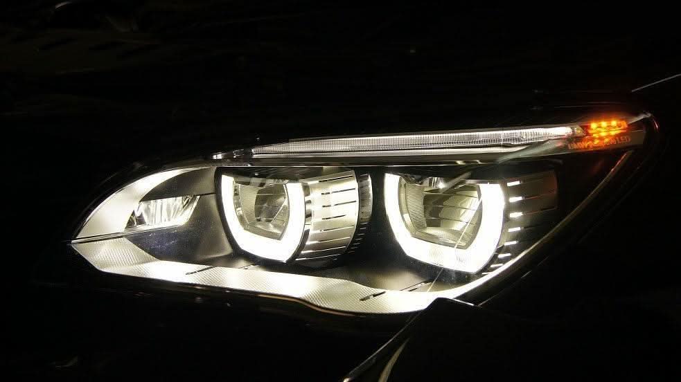 BMW 7 Series F01/F02 headlight upgrade by K2 Industries, showing sleek OE headlights for models 2009-2015.