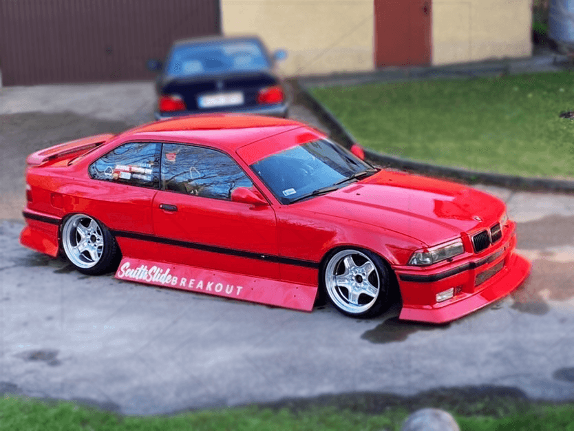 BMW E36 JDM Style Front Lip V2 by K2 Industries, front bumper lip for 1992-1999 BMW E36 model, showing the sleek black design.