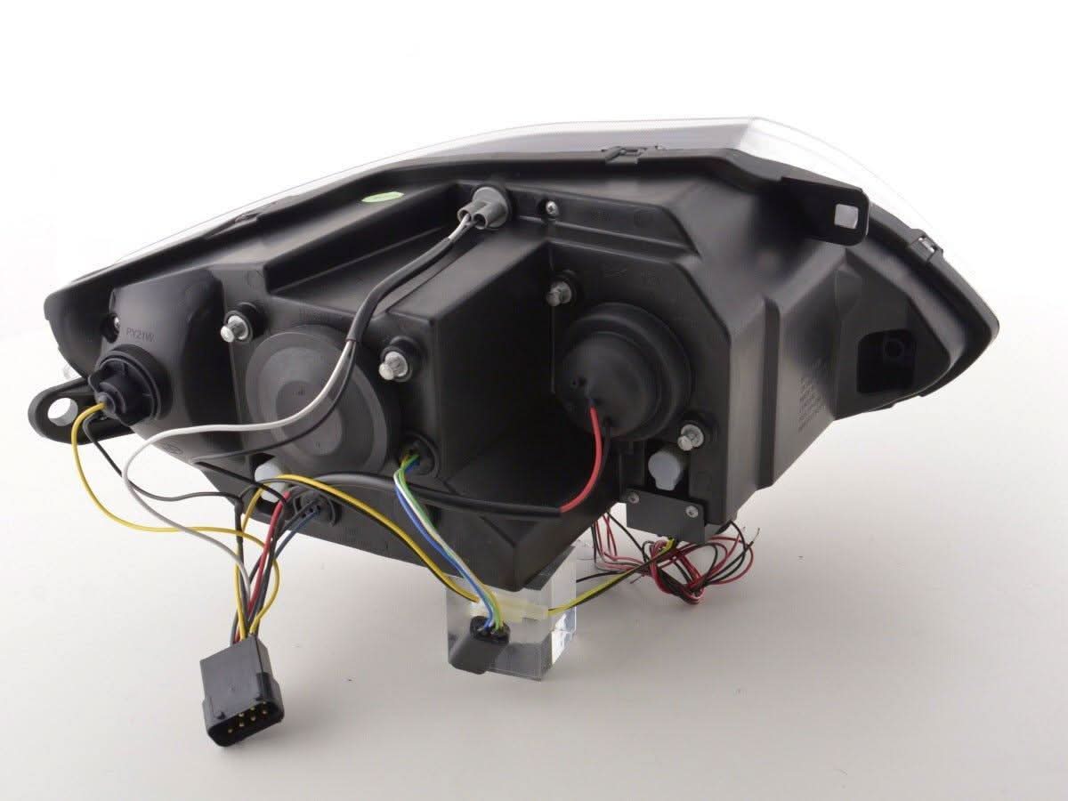 Pair of black BMW Z4 E85 E86 headlights by K2 Industries for 2003-2008 model, featuring sleek design and clear lens covers.