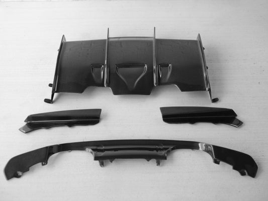 BMW F80 M3 and F82/F83 M4 carbon fiber rear diffuser by Palenon Performance, showcasing sleek, aerodynamic design and high-quality finish.