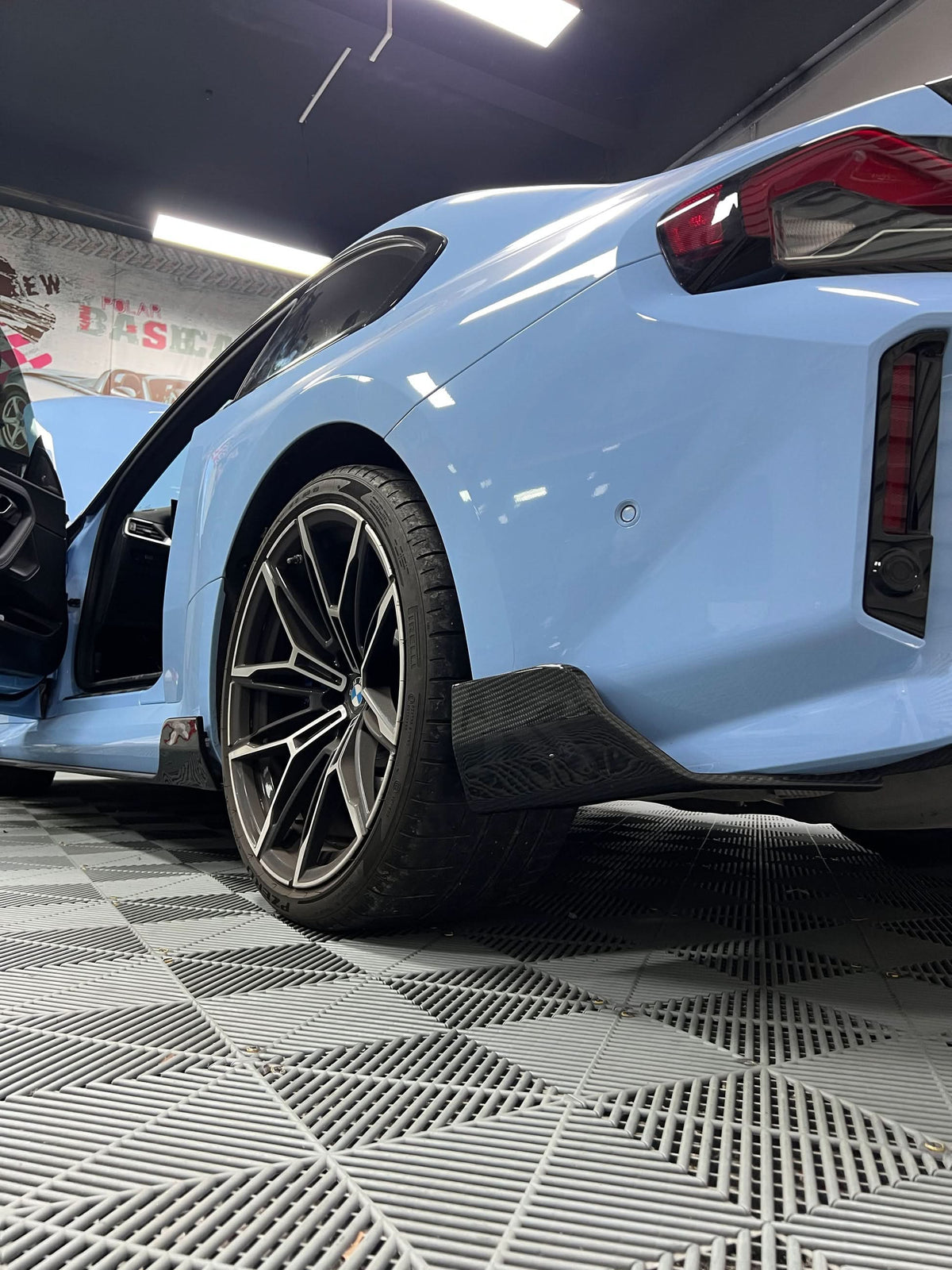 BMW 2 Series G87 M2 Carbon Fiber Rear Splitters by K2 Industries, showcasing sleek aerodynamic design and high-quality carbon fiber material.