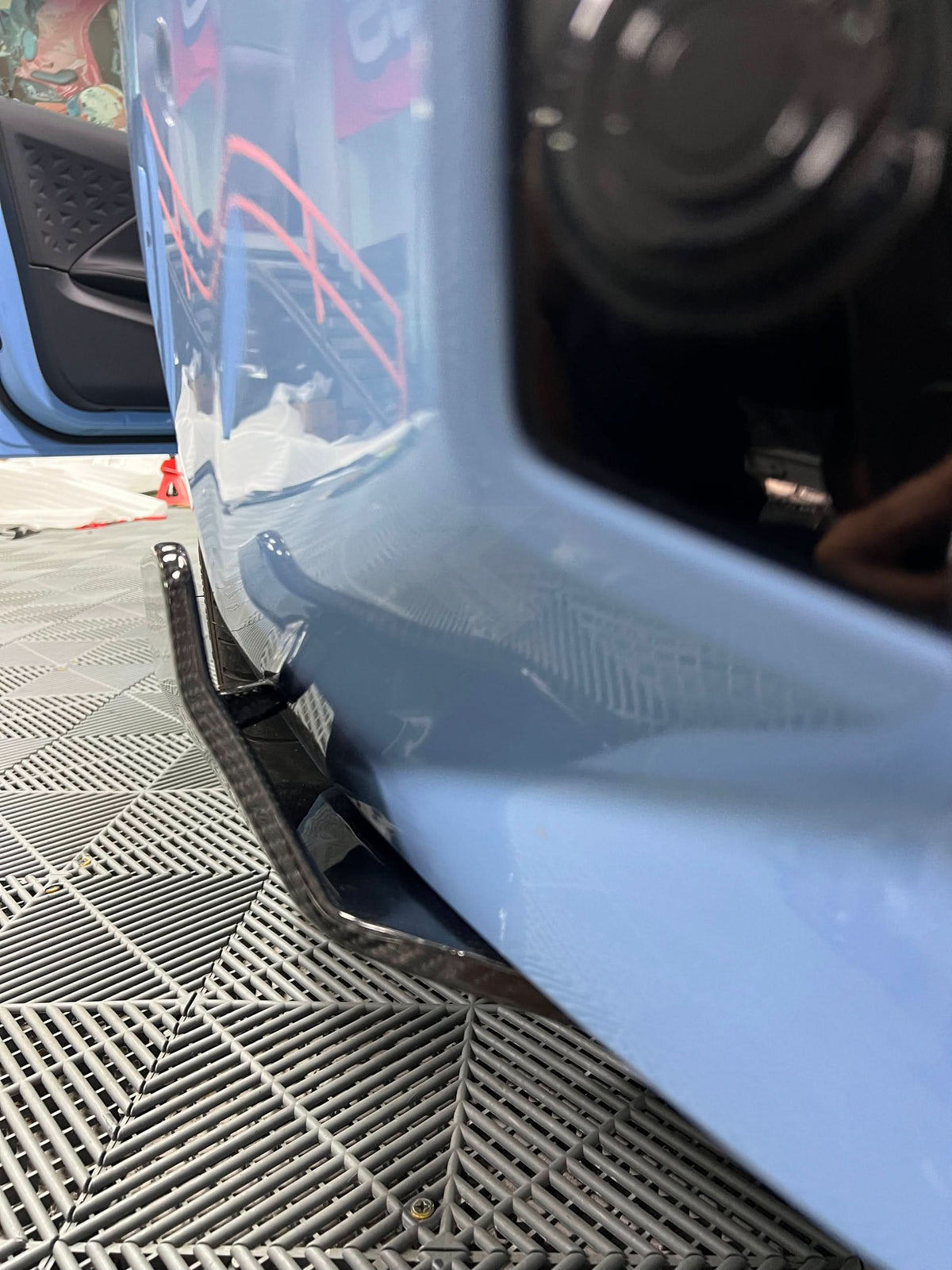 BMW 2 Series G87 M2 carbon fiber rear splitters by K2 Industries, showing the sleek, aerodynamic design of the splitters.