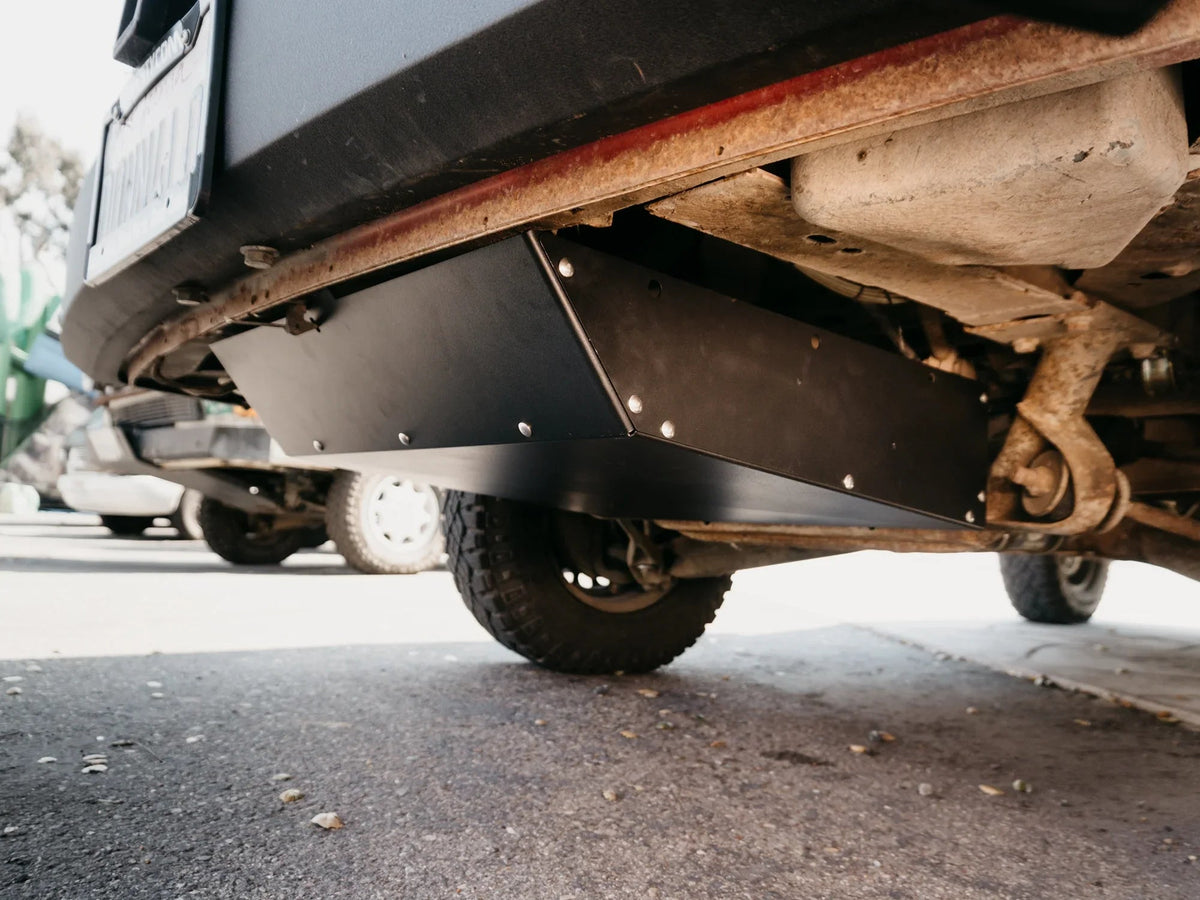 GoWesty Vanagon spare tire location storage box installed in rear cargo area