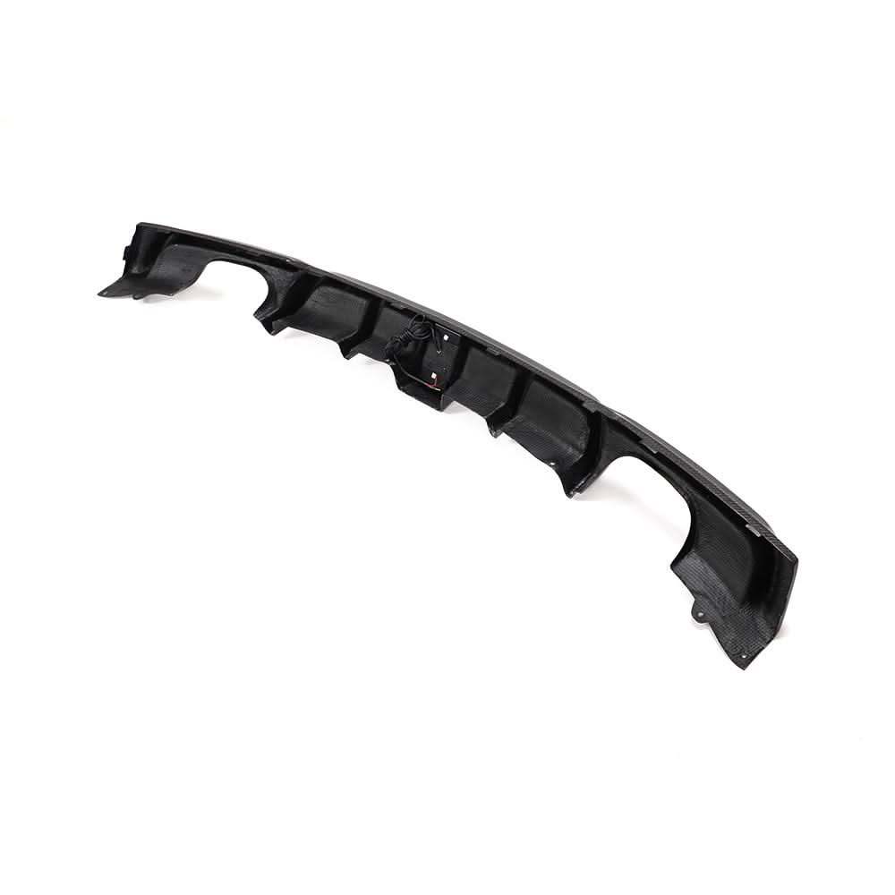 Carbon fiber rear diffuser with integrated LED brake light for BMW F30 and F31 M Sport models, by K2 Industries.