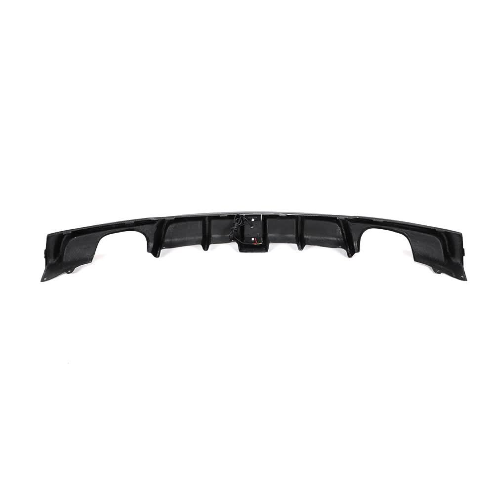 Carbon fiber rear diffuser with LED brake light for BMW F30 & F31 M Sport, showing sleek design and integrated LED lighting.