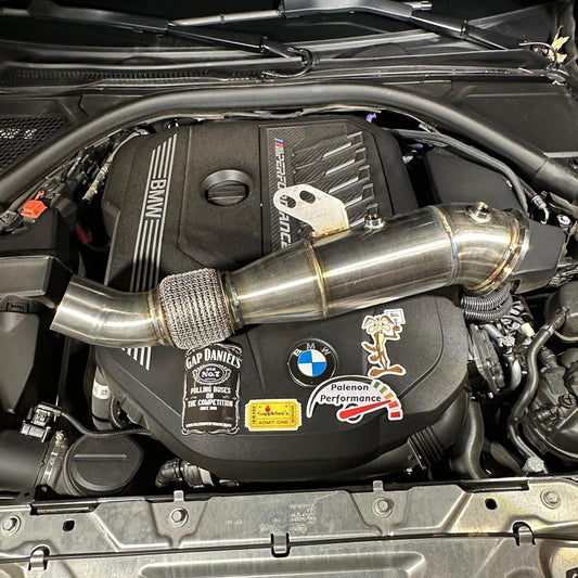 Palenon Performance B58 Racing Downpipe for BMW and Supra, showing the metallic downpipe with logo and mounting flanges.