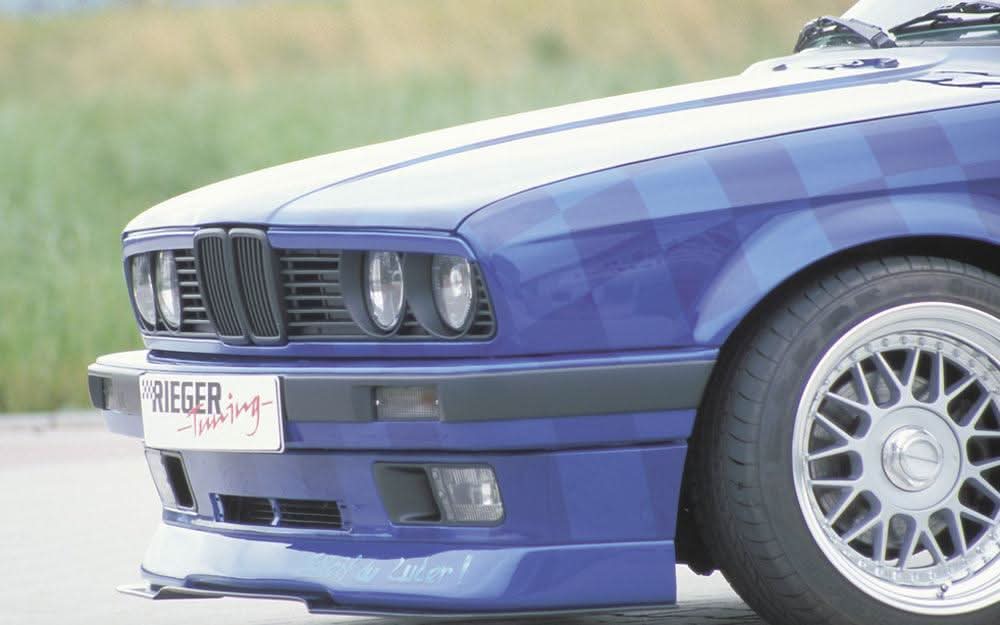 K2 Industries BMW E30 facelift front lip spoiler, sleek black front lip for BMW E30 model, enhances aerodynamics and style.