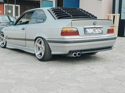 Black windshield louvers on a BMW E36 Coupe Series 3, gray background, showcasing K2 Industries louvers for 1992-1999 models.