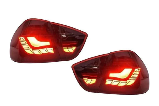 BMW 3 Series E90 M3 GTS OLED tail lights by K2 Industries, showing sleek black housing and illuminated red and clear lenses.
