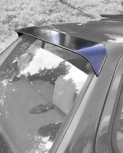 BMW E30 3 Series roof spoiler by K2 Industries, designed for models from 1982 to 1994, shown on a silver vehicle.