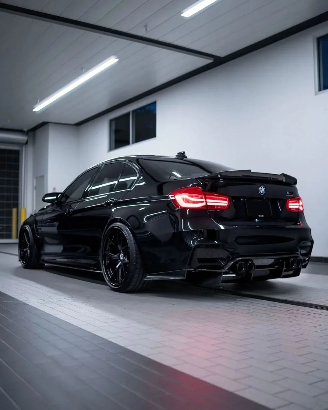 BMW 3 Series F30 F35 M3 F80 sedan carbon fiber trunk spoiler by K2 Industries, showcasing sleek PSM style design on the vehicle.