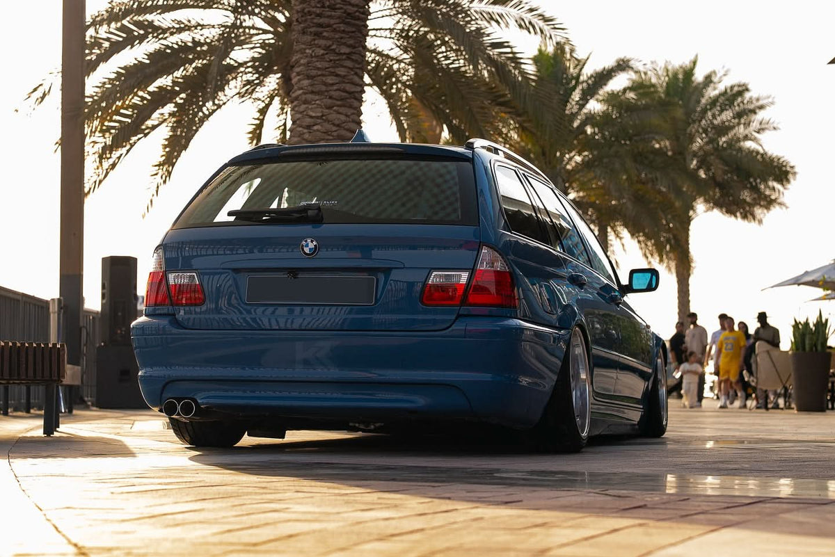 BMW 3 Series E46 wagon red LED tail lights set by K2 Industries, showing close-up of illuminated brake and turn signal lights.