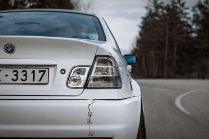 BMW 3-Series E46 sedan clear tail lights by K2 Industries, showing the sleek, transparent design for model years 1998-2006.
