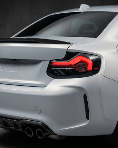 BMW 2-Series F22 F23 M2 F87 220i 225i F44 smoked LED tail lights by K2 Industries installed on the vehicle.