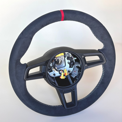 Red manual Porsche 991.2 steering wheel interior trim by Boston Motortech, showing detailed red leather and control accents.