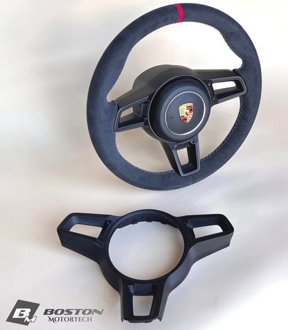 Red manual steering wheel for Porsche 991.2 by Boston Motortech, featuring a sporty design and premium craftsmanship.