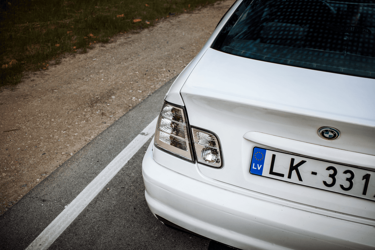 BMW 3-Series E46 sedan clear tail lights by K2 Industries, showing the sleek, transparent design for model years 1998-2006.
