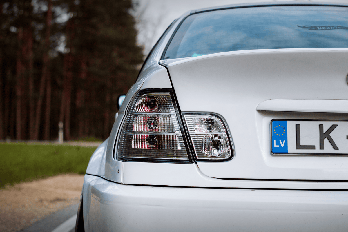 BMW 3-Series E46 sedan clear tail lights by K2 Industries, showing the sleek design and clear lens covers for 1998-2006 models.