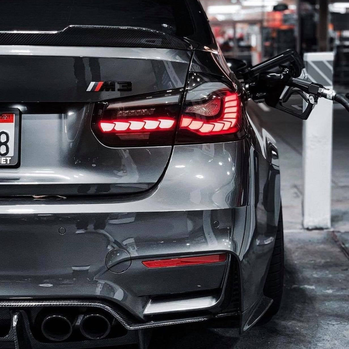 BMW GTS OLED sequential tail light for M3 F80, F30 340i, 335i, 330i, 328i, 320i by Palenon Performance, showing illuminated tail light.