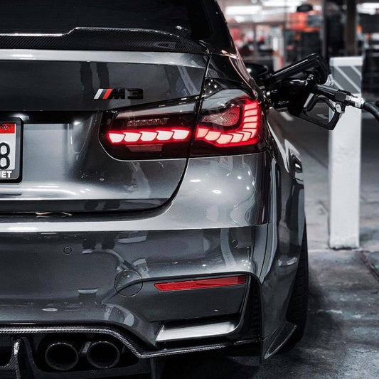 BMW GTS OLED sequential tail light for M3 F80, F30 340i, 335i, 330i, 328i, 320i by Palenon Performance, showing illuminated tail light.