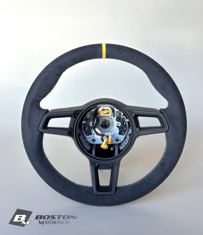 Yellow manual Porsche 991.2 steering wheel by Boston Motortech, showing leather wrapping and detailed grip design