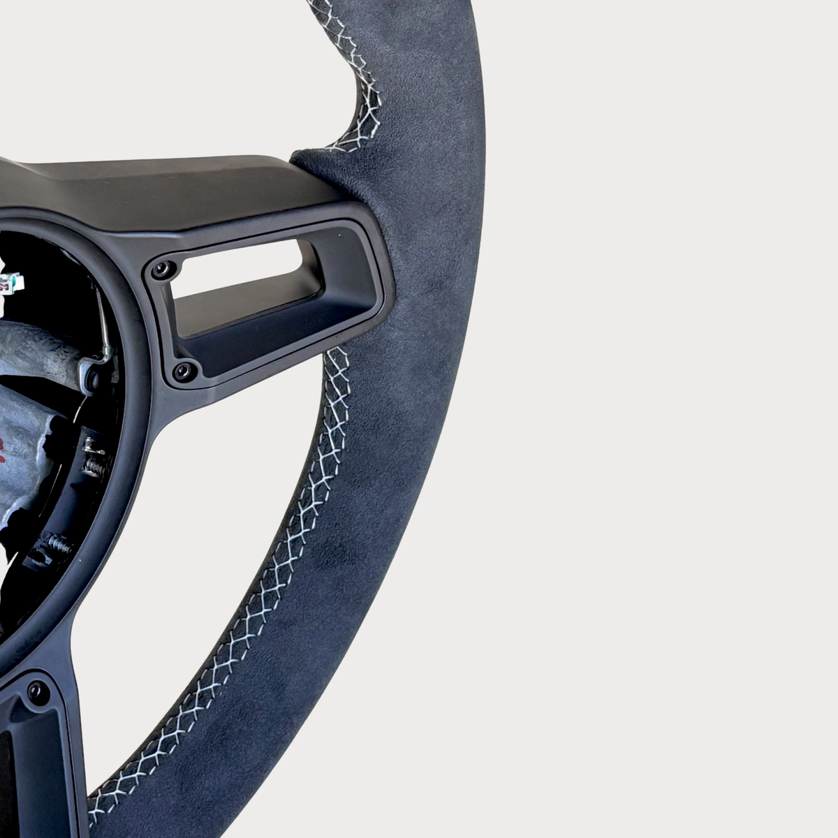 Red manual Porsche 991.2 steering wheel by Boston Motortech with detailed grip and control buttons, designed for sporty driving.