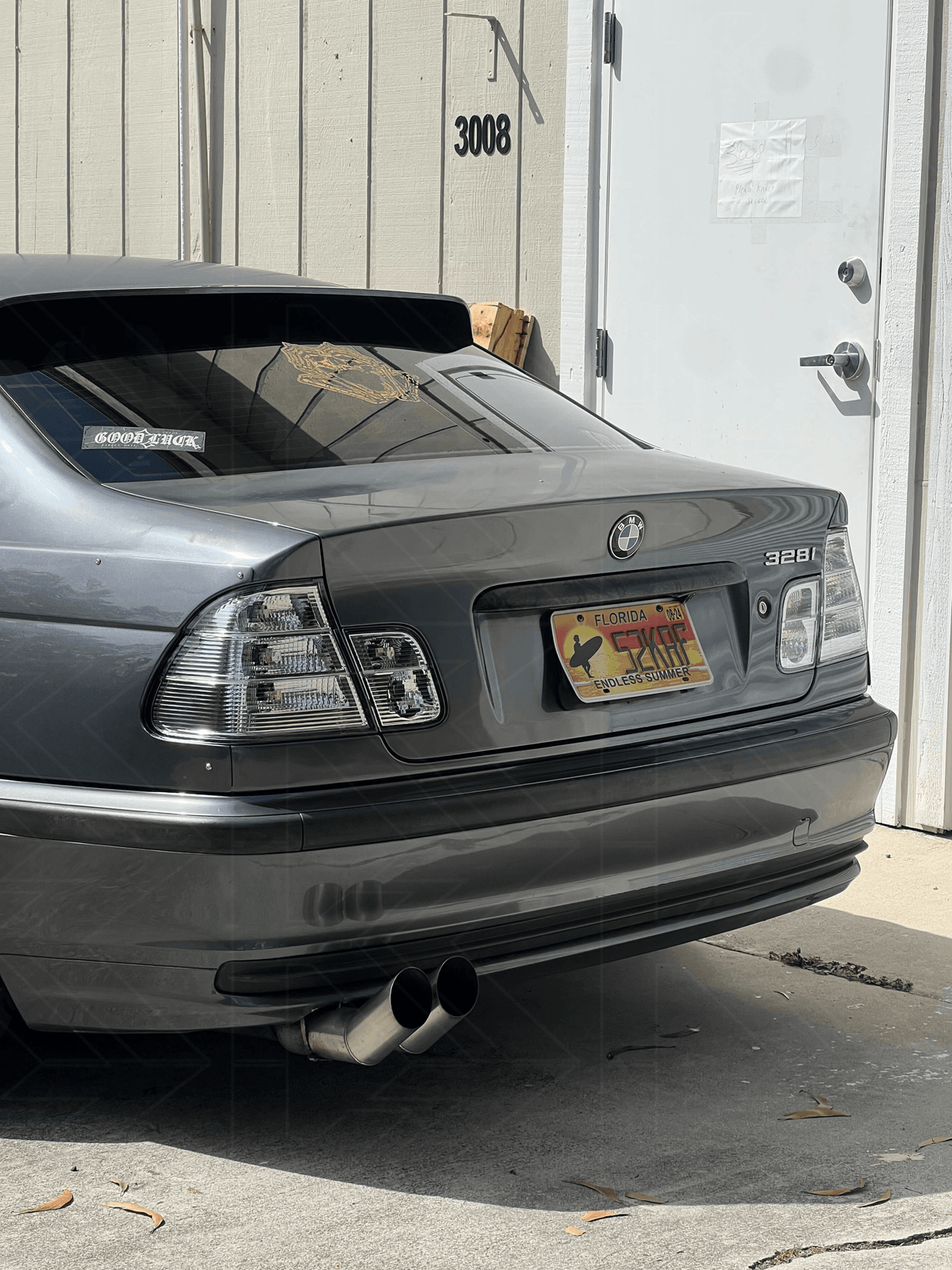 BMW 3-Series E46 sedan clear tail lights by K2 Industries, showing front and side view of the sleek, transparent design.