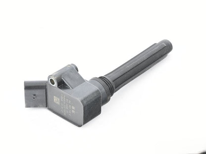 Genuine OEM Audi VW 06L905110K ignition coil for engine, shown with electrical connectors and metal casing.