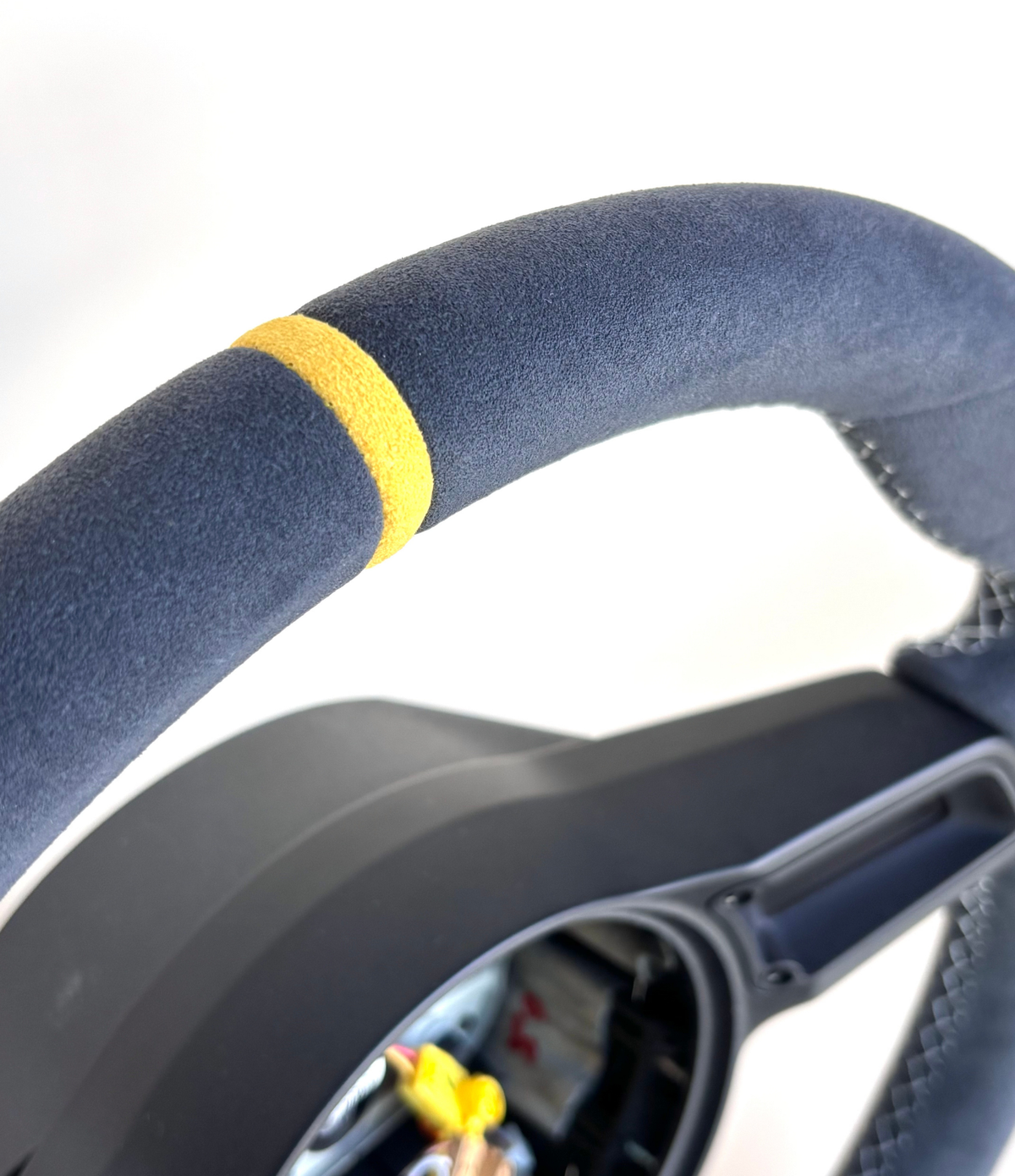 Yellow manual Porsche 991.2 steering wheel by Boston Motortech, featuring textured grip and sporty design.