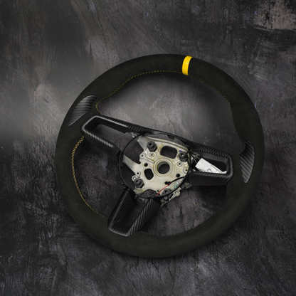 Custom Porsche 911 (992), Taycan, Macan steering wheel by Exclusive Steering featuring black leather and silver accents.