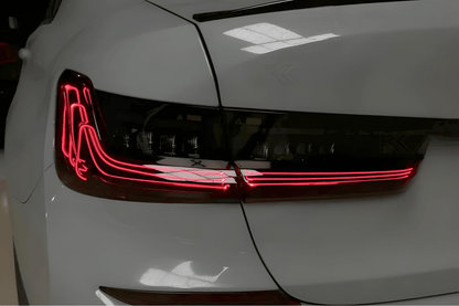 BMW 3 Series G20 G28 tail lights in red and smoked CSL style with laser accents by K2 Industries, shown on a 2019-2024 model.