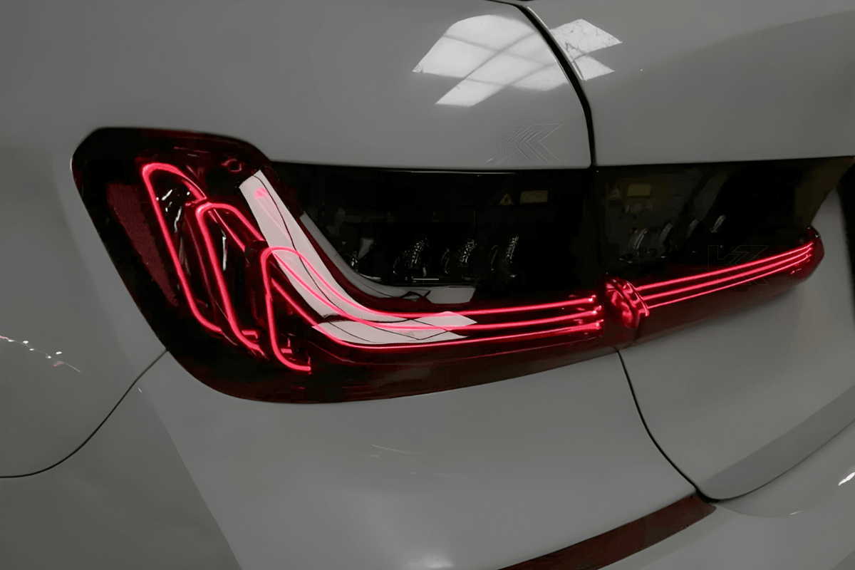 BMW 3 Series G20 G28 tail lights with red and smoked CSL style laser design by K2 Industries, installed on a 2019-2024 model.