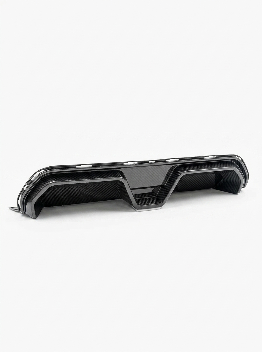 BMW 5 Series F90 M5 CS style carbon fiber rear diffuser by K2 Industries, showing sleek, textured carbon fiber design on the vehicle.