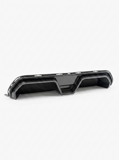 BMW 5 Series F90 M5 CS style carbon fiber rear diffuser by K2 Industries, showing sleek, textured carbon fiber design on the vehicle.