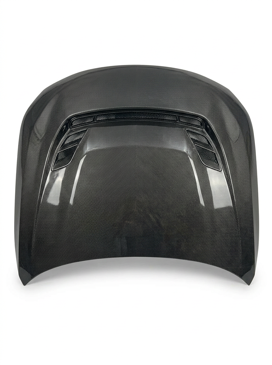 BMW 2 Series G87 M2 carbon fiber hood by K2 Industries, showing sleek black textured surface and aerodynamic design.