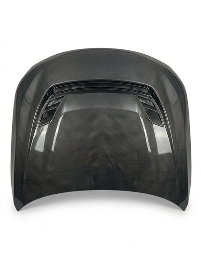 BMW 2 Series G87 M2 carbon fiber hood by K2 Industries, showing sleek black textured surface and aerodynamic design.