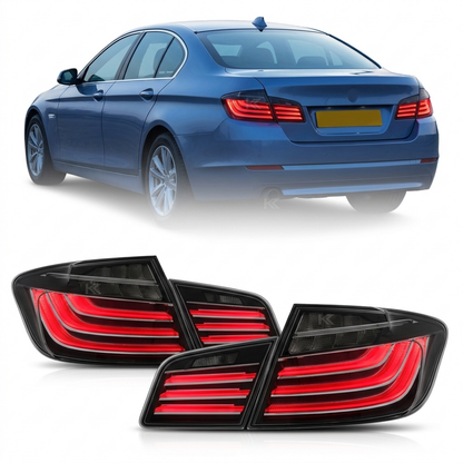Black LED tail lights for BMW 5 Series F10 (2011-2017) by K2 Industries, showcasing sleek black design and modern lighting elements.
