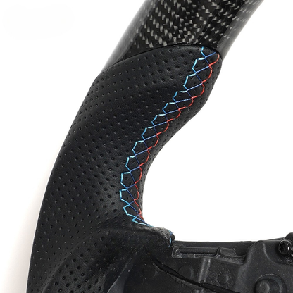 Vekto M Sport carbon fiber steering wheel for BMW G Series showing sleek black carbon fiber surface and sporty design